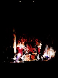 a fire burning in a dark room